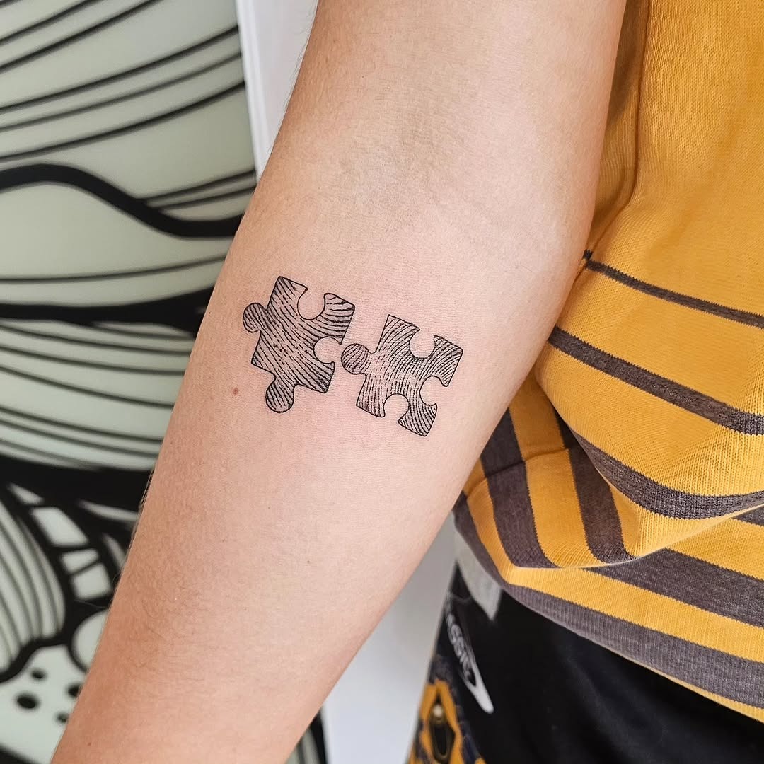 Stylish puzzle piece tattoo for connection lovers Tattoo Design