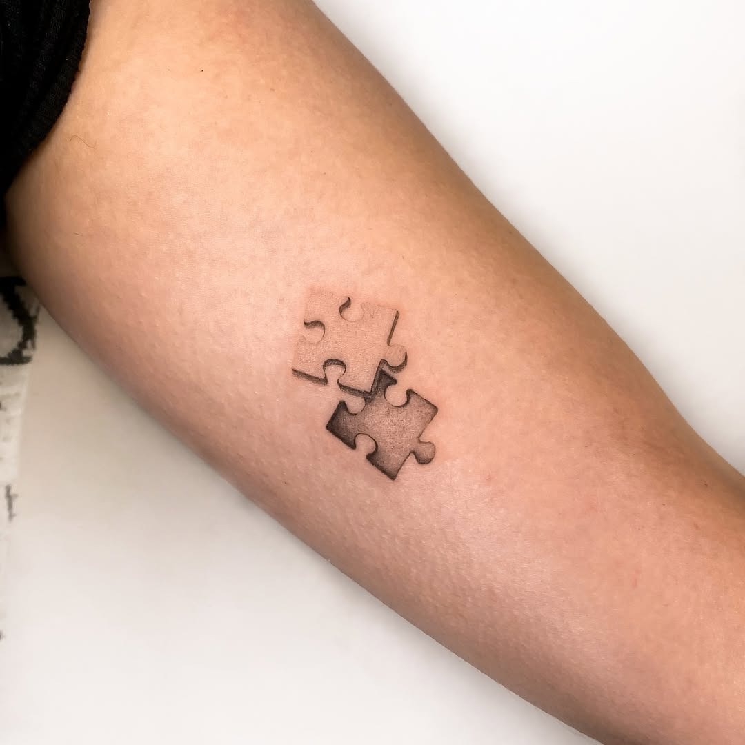 Stylish puzzle piece tattoo with shading Tattoo Design