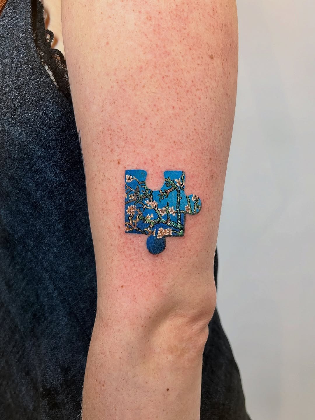 Vibrant Puzzle Piece Tattoo with Floral Patterns Tattoo Design