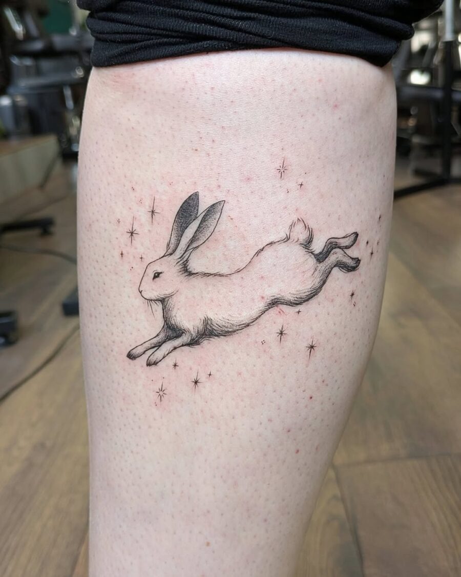 A whimsical leaping rabbit tattoo design. Tattoo Design