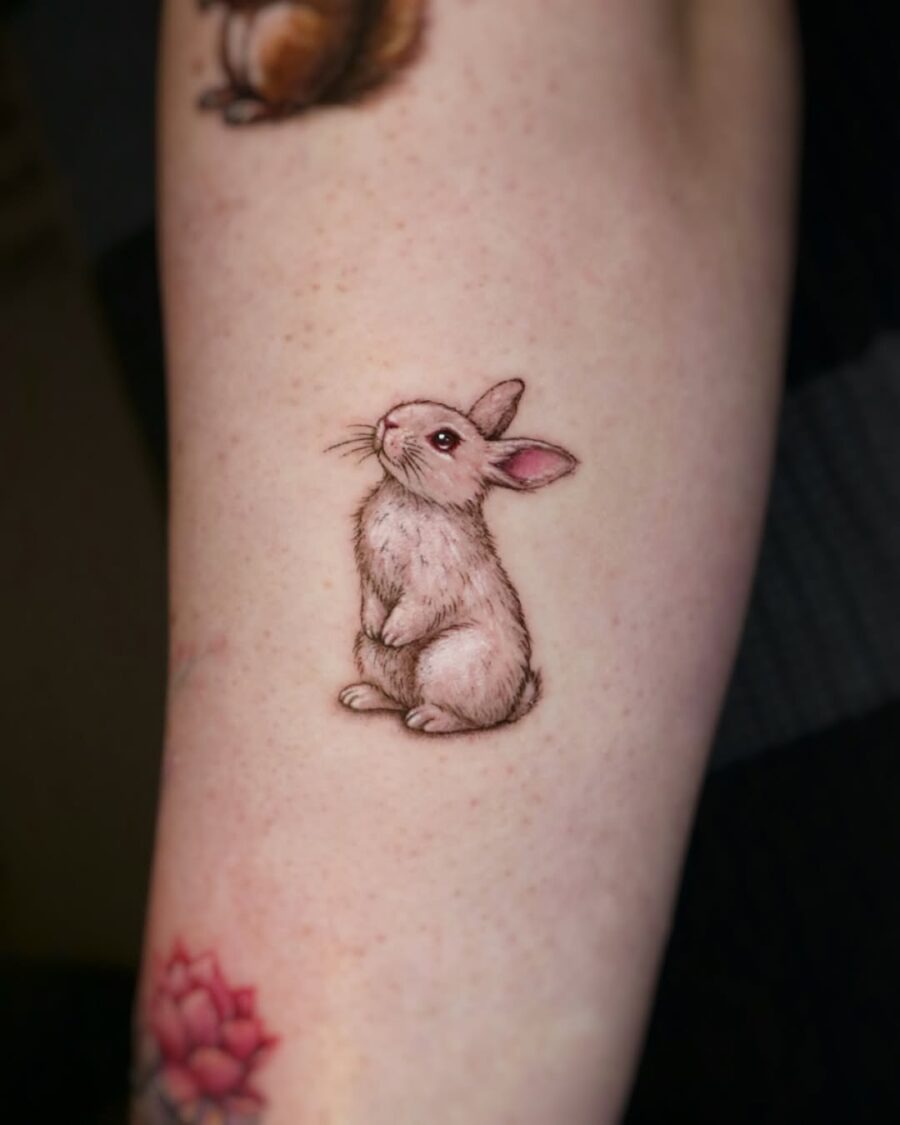 Adorable realistic rabbit tattoo on arm Tattoo Design