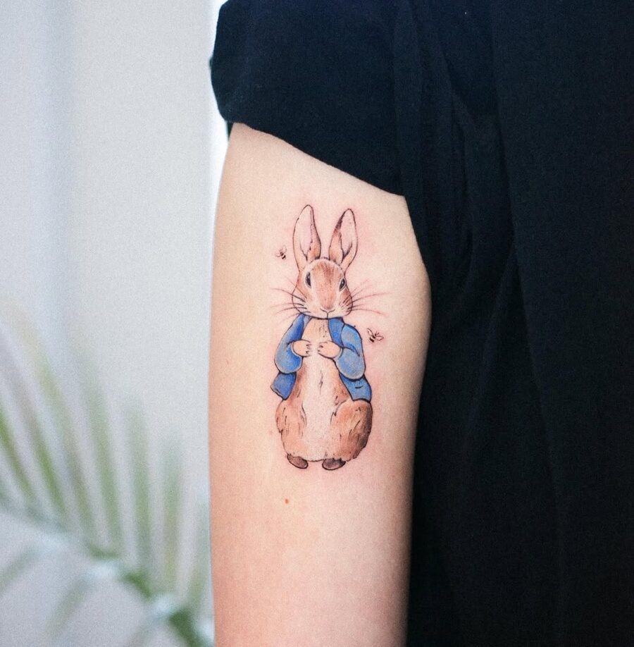 Charming rabbit tattoo in a cozy outfit Tattoo Design