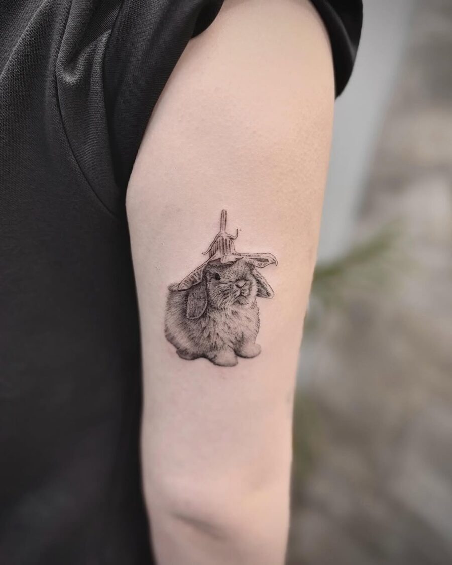 Charming rabbit tattoo with a playful hat Tattoo Design