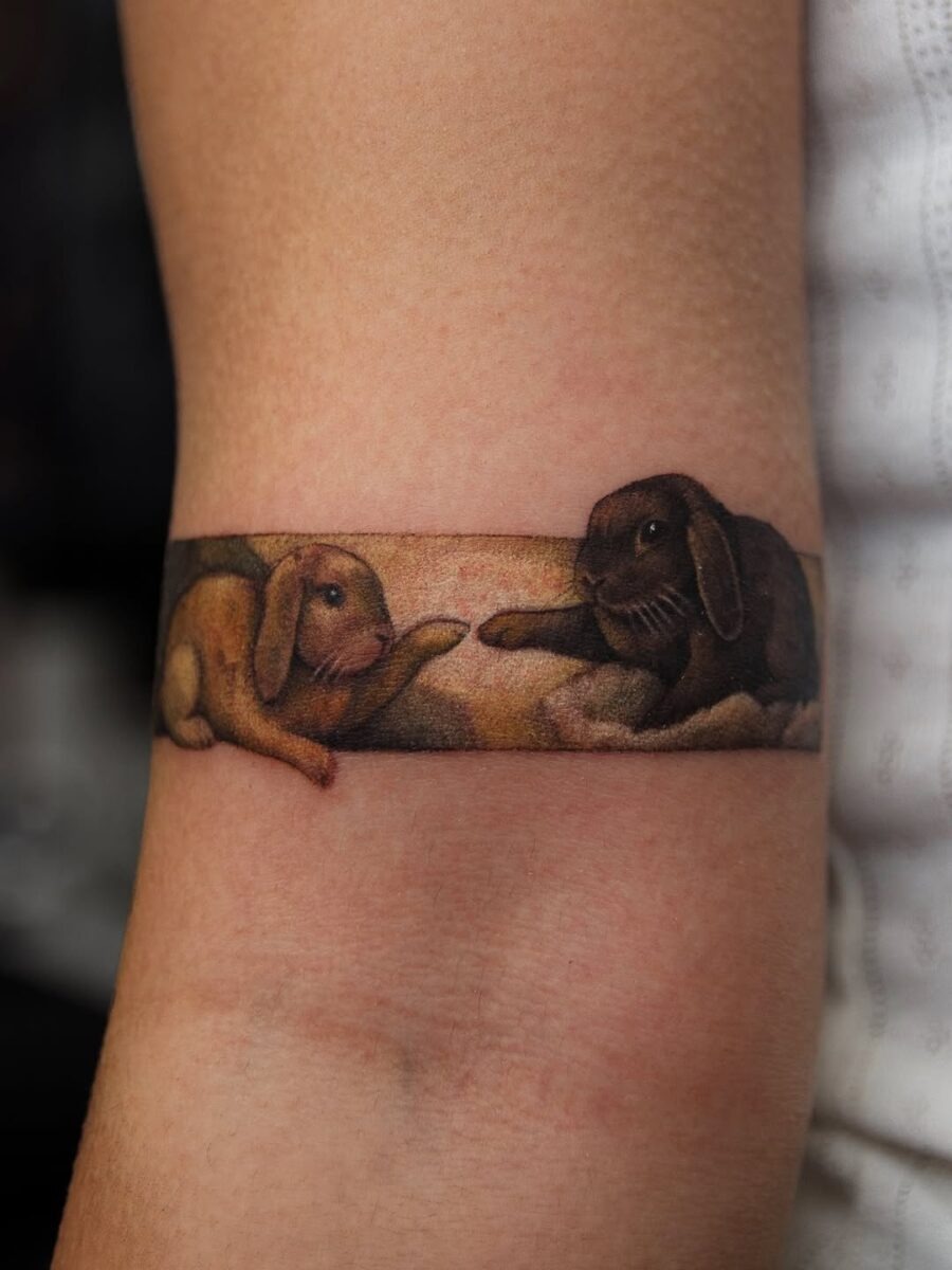 Charming rabbit tattoo with clover symbol Tattoo Design