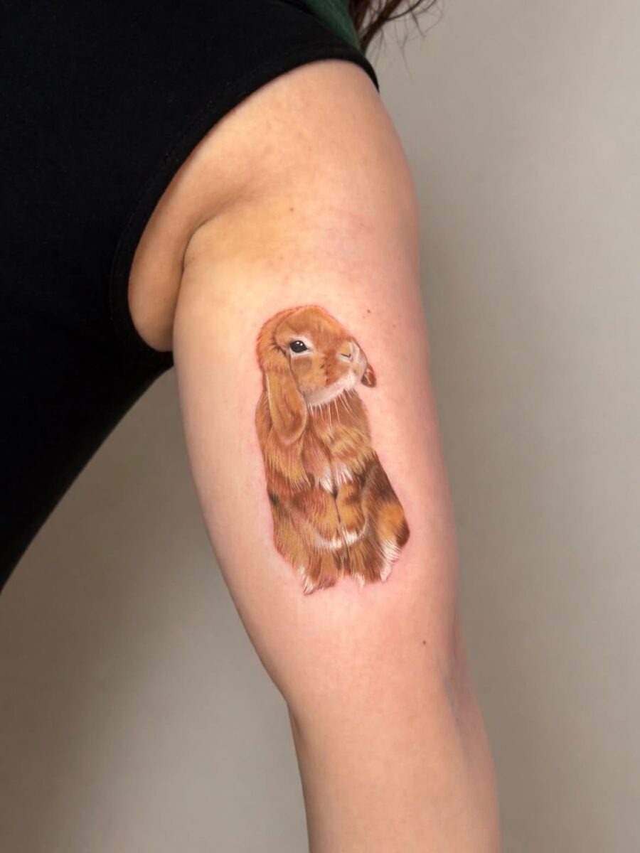 Charming Rabbit Tattoo with Lifelike Detail Tattoo Design