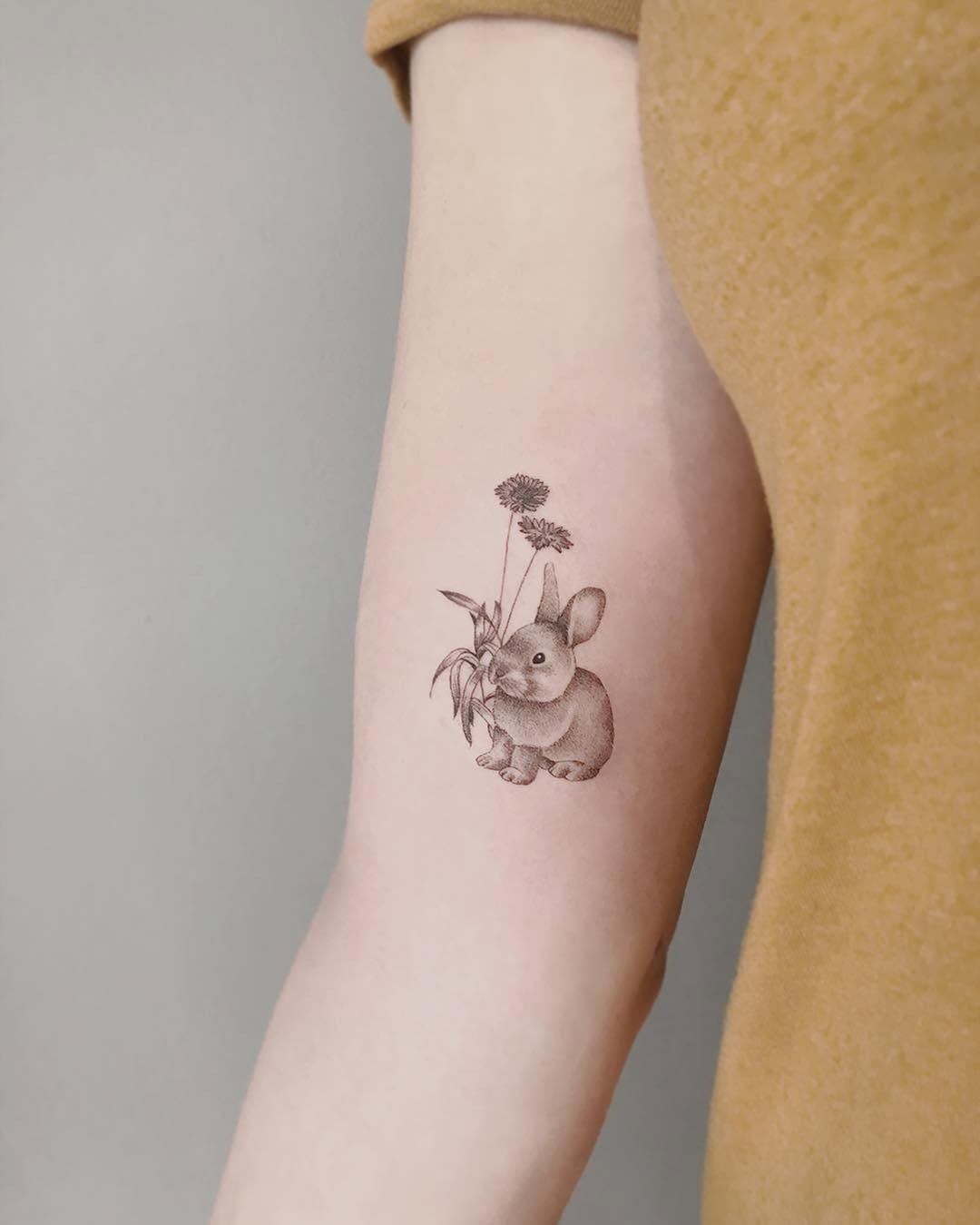 Charming realistic rabbit tattoo design ideas Tattoo Design