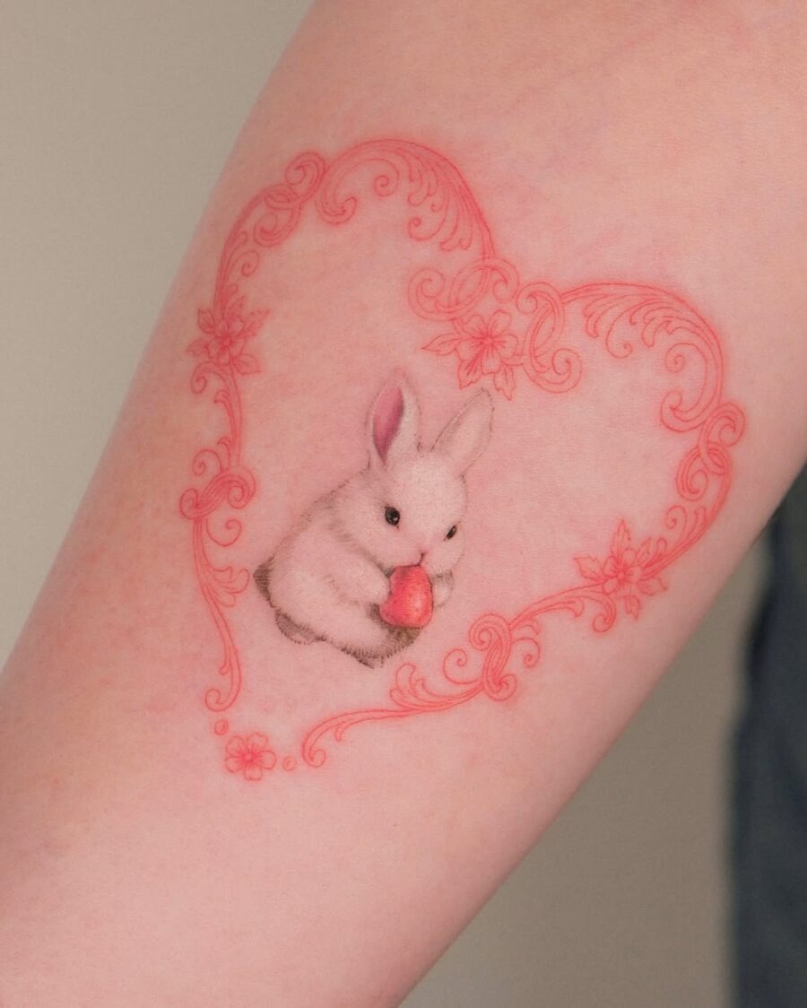 Delicate rabbit tattoo within floral heart frame Tattoo Design