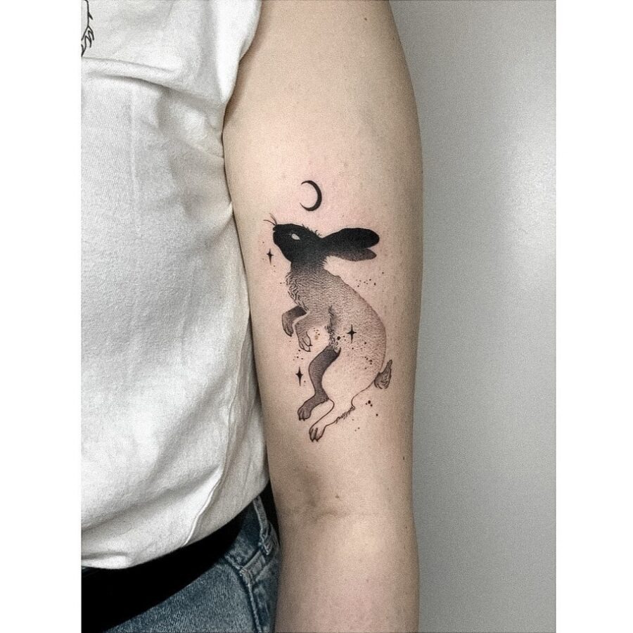 Enchanting rabbit tattoo with celestial elements Tattoo Design