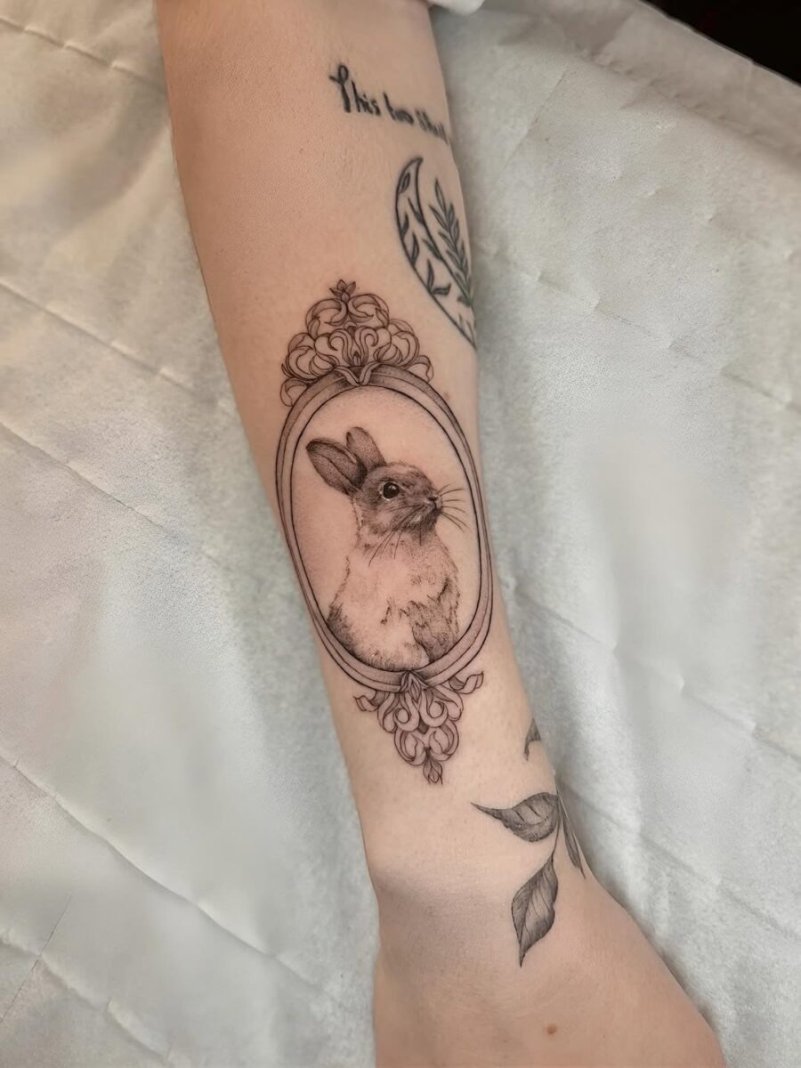 Framed rabbit tattoo with elegant detail Tattoo Design