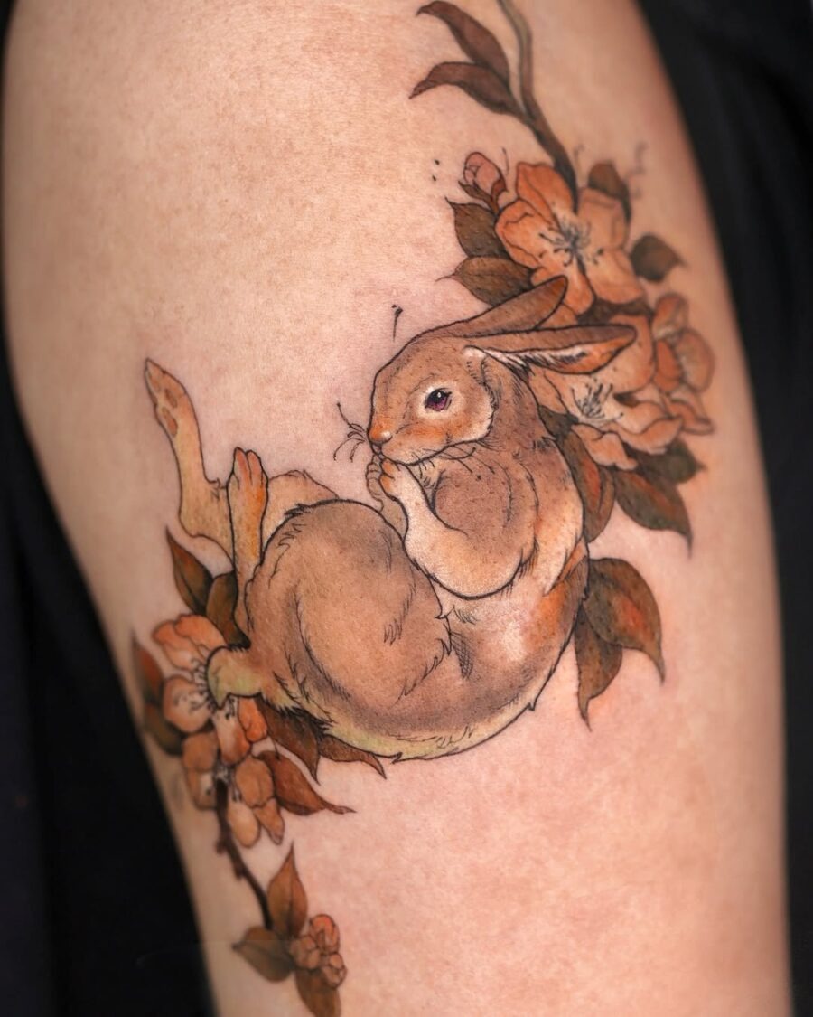 Whimsical rabbit tattoo surrounded by blooms Tattoo Design