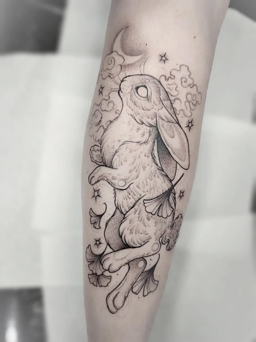 Whimsical rabbit tattoo with nature elements Tattoo Design