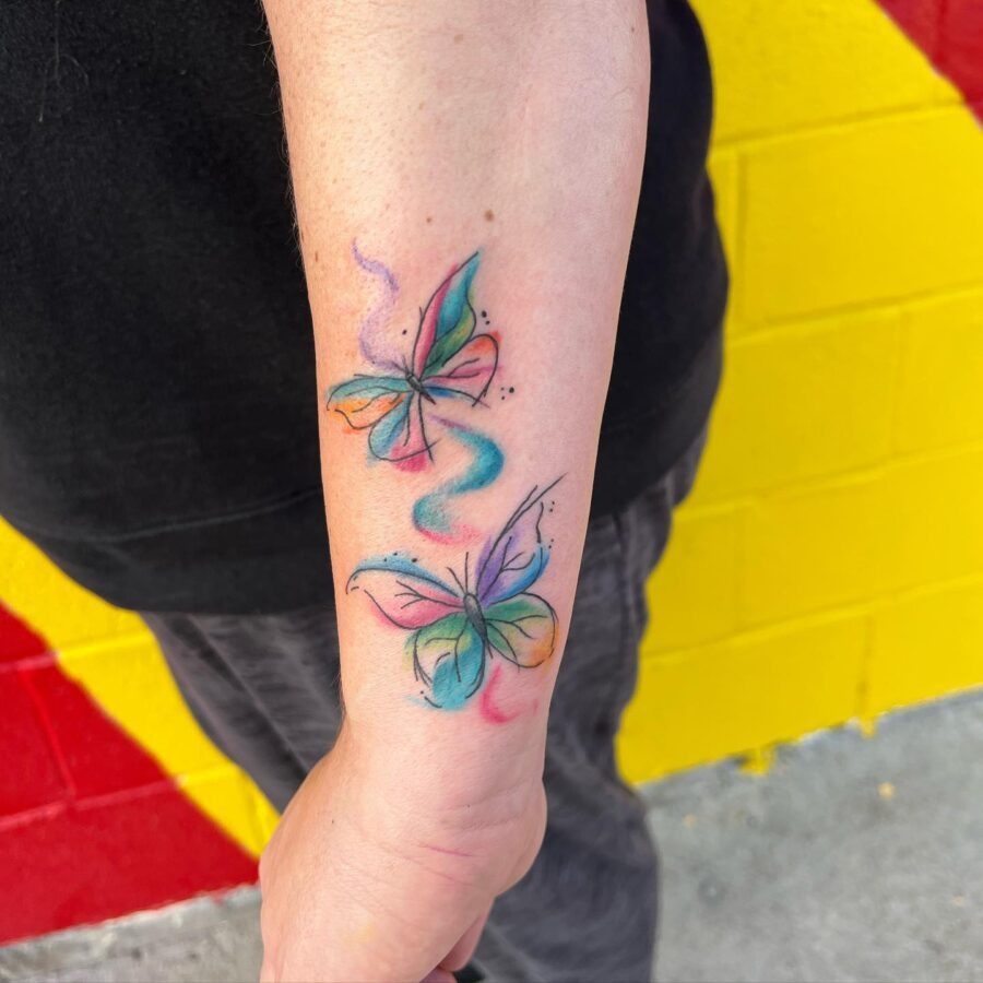 A delicate rainbow baby tattoo with heart symbolism Tattoo Design