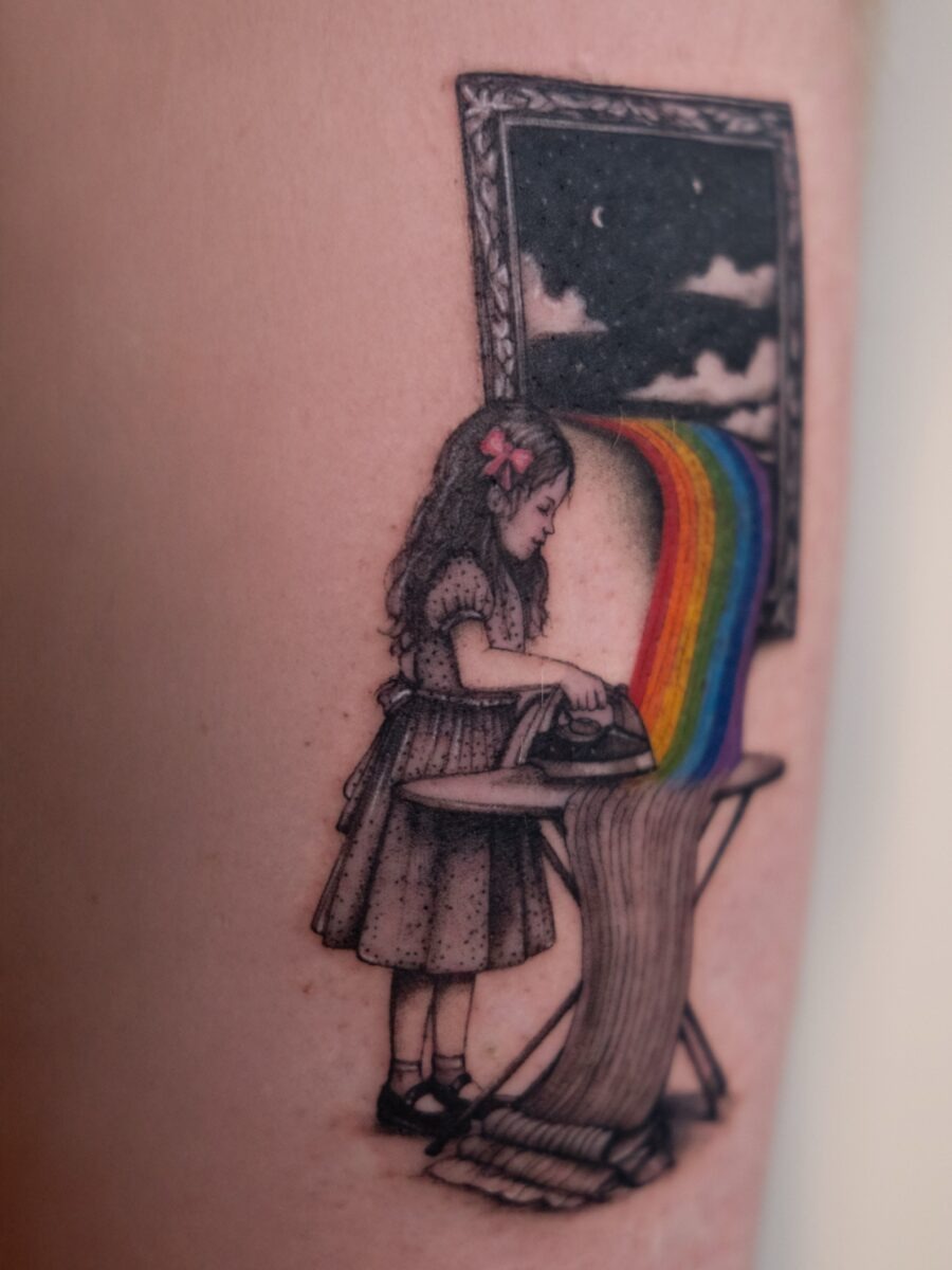 Charming girl ironing a vibrant rainbow tattoo Tattoo Design