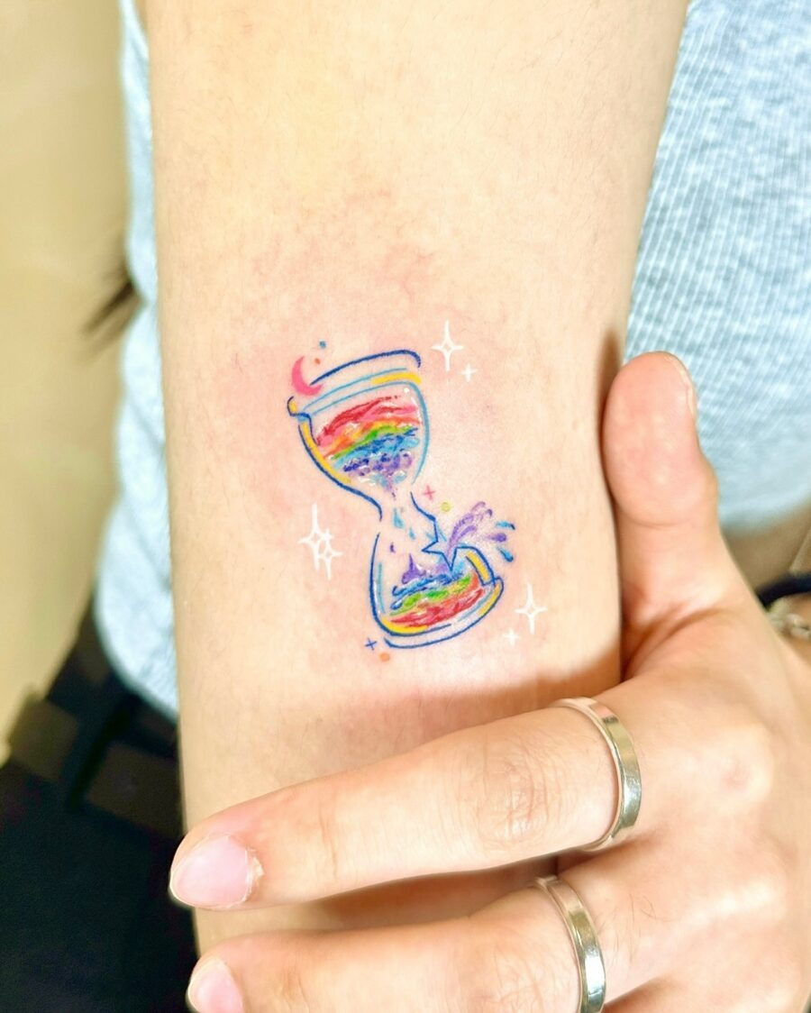 Charming rainbow baby tattoo on shoulder Tattoo Design