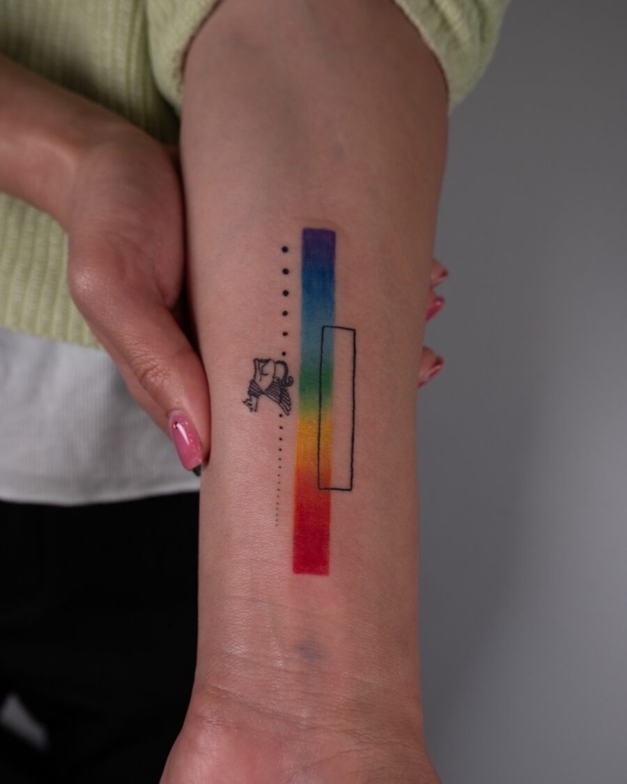 Colorful rainbow baby tattoo on the arm Tattoo Design