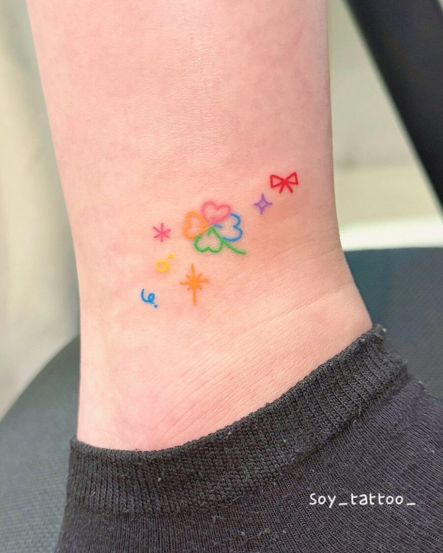Delicate Rainbow Flower Tattoo With Joyful Accents Tattoo Design