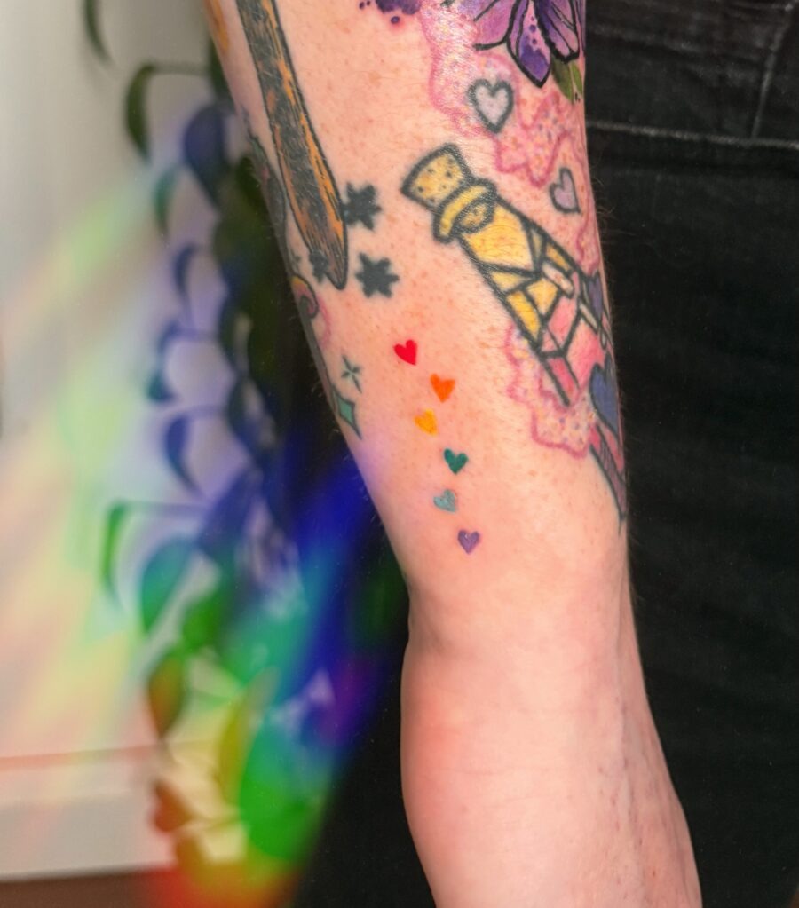 Emotive tribute through rainbow baby ink Tattoo Design
