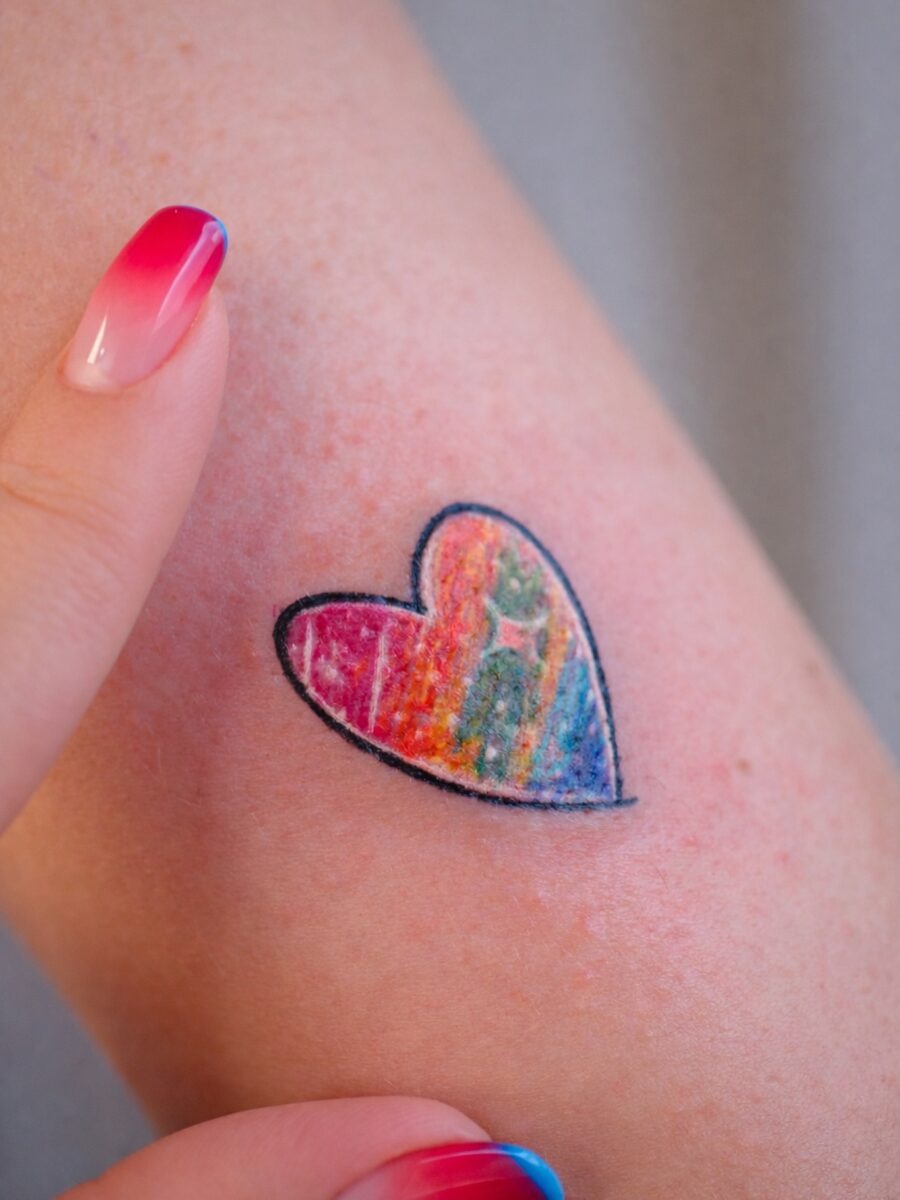 Vibrant heart tattoo celebrating rainbow babies Tattoo Design
