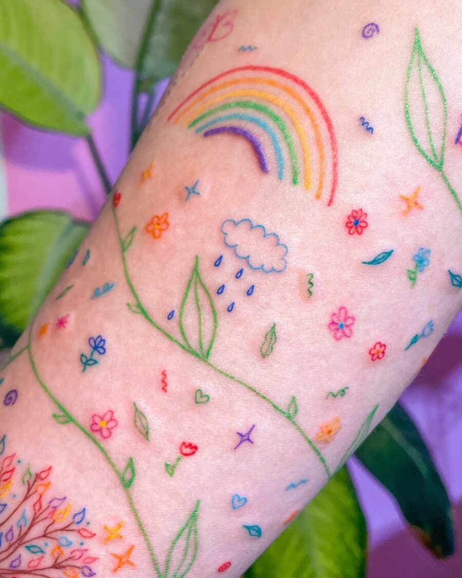 Vibrant Rainbow Baby Tattoo Celebrating Life Tattoo Design