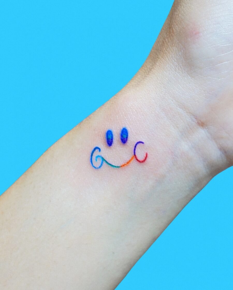 Vibrant Smiley Rainbow Baby Tattoo Design Tattoo Design
