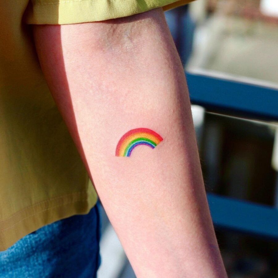 Whimsical rainbow baby dinosaur tattoo design Tattoo Design
