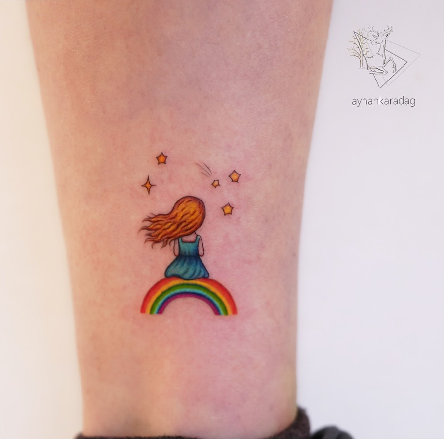 Whimsical rainbow baby tattoo with girl figure Tattoo Design