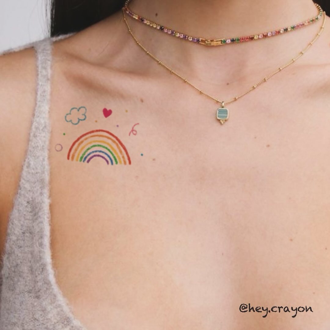 Charming Rainbow Tattoo with Playful Elements Tattoo Design