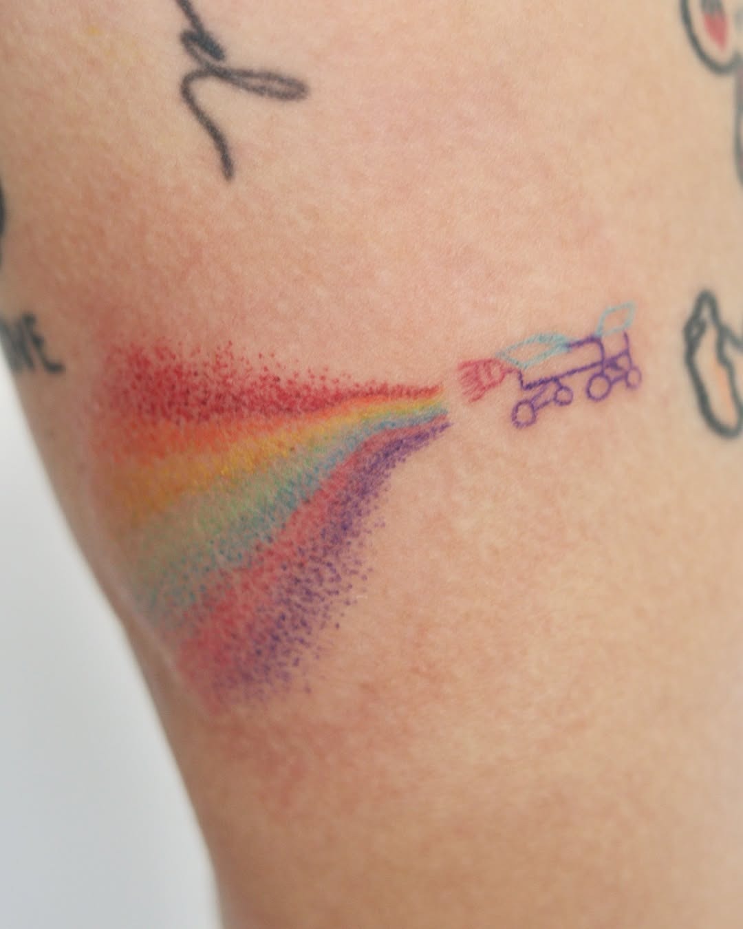 Colorful Rainbow Tattoo with Skateboard Tattoo Design