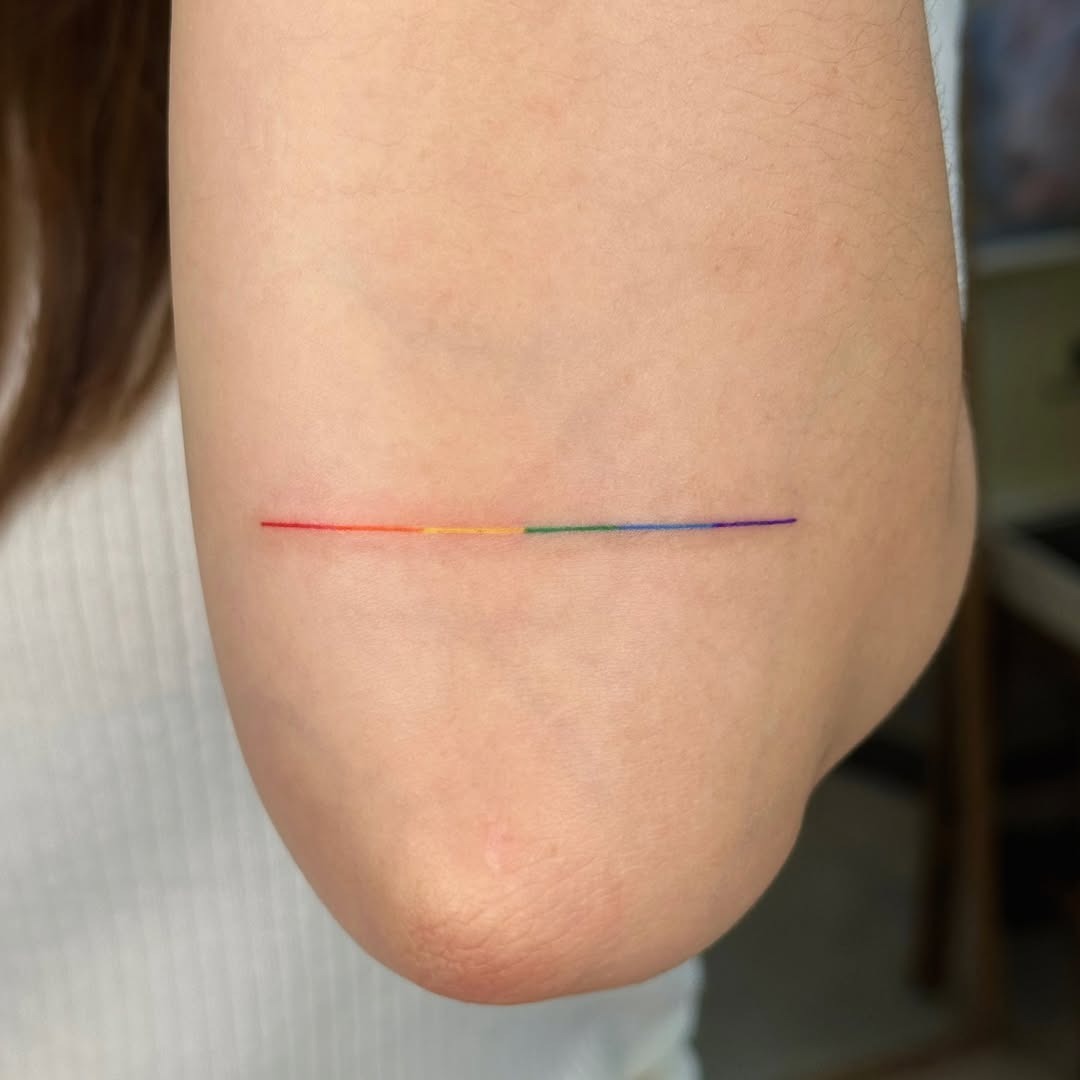 Minimalist Rainbow Tattoo on Elbow Tattoo Design