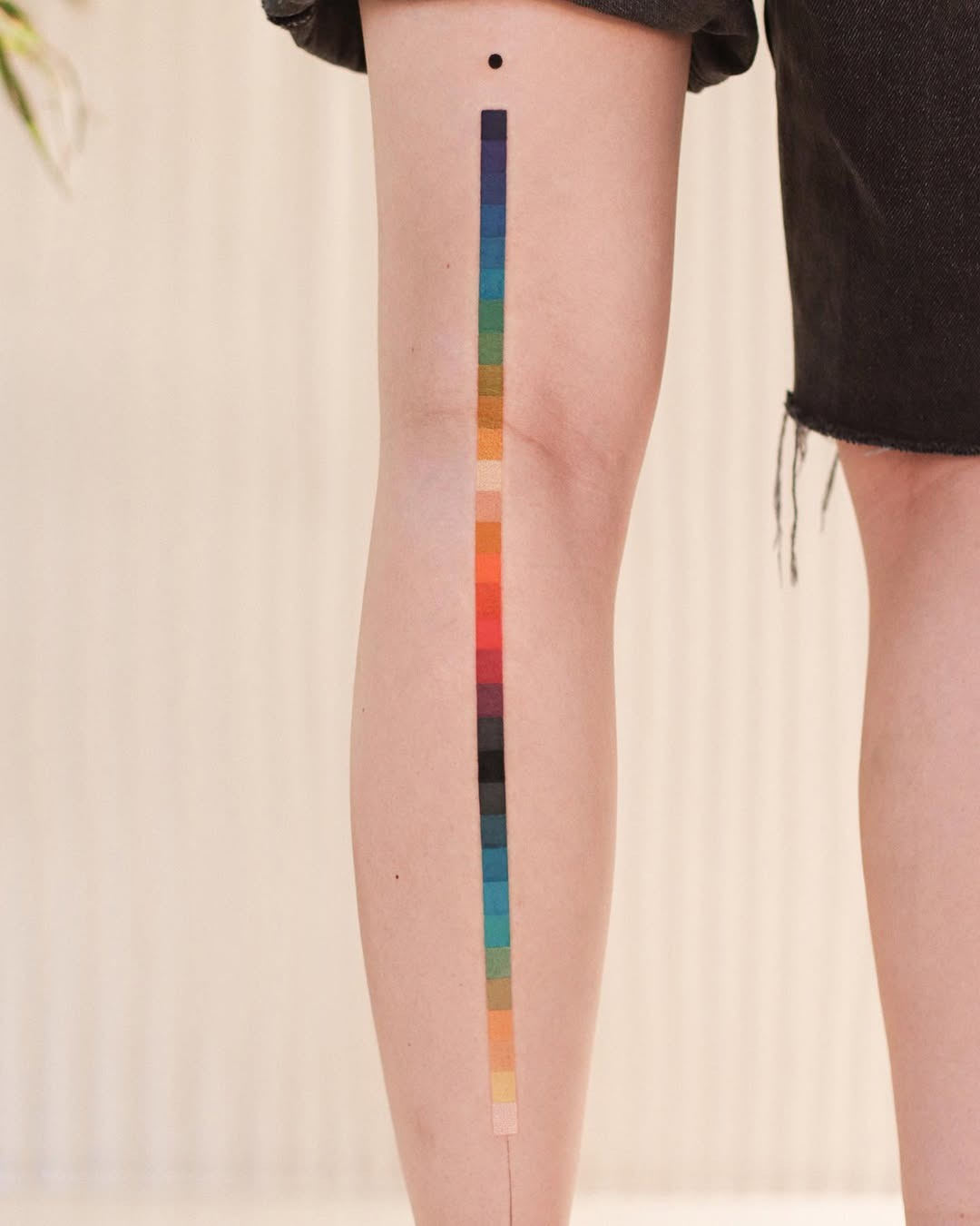 Minimalist Rainbow Tattoo on Stylish Leg Tattoo Design