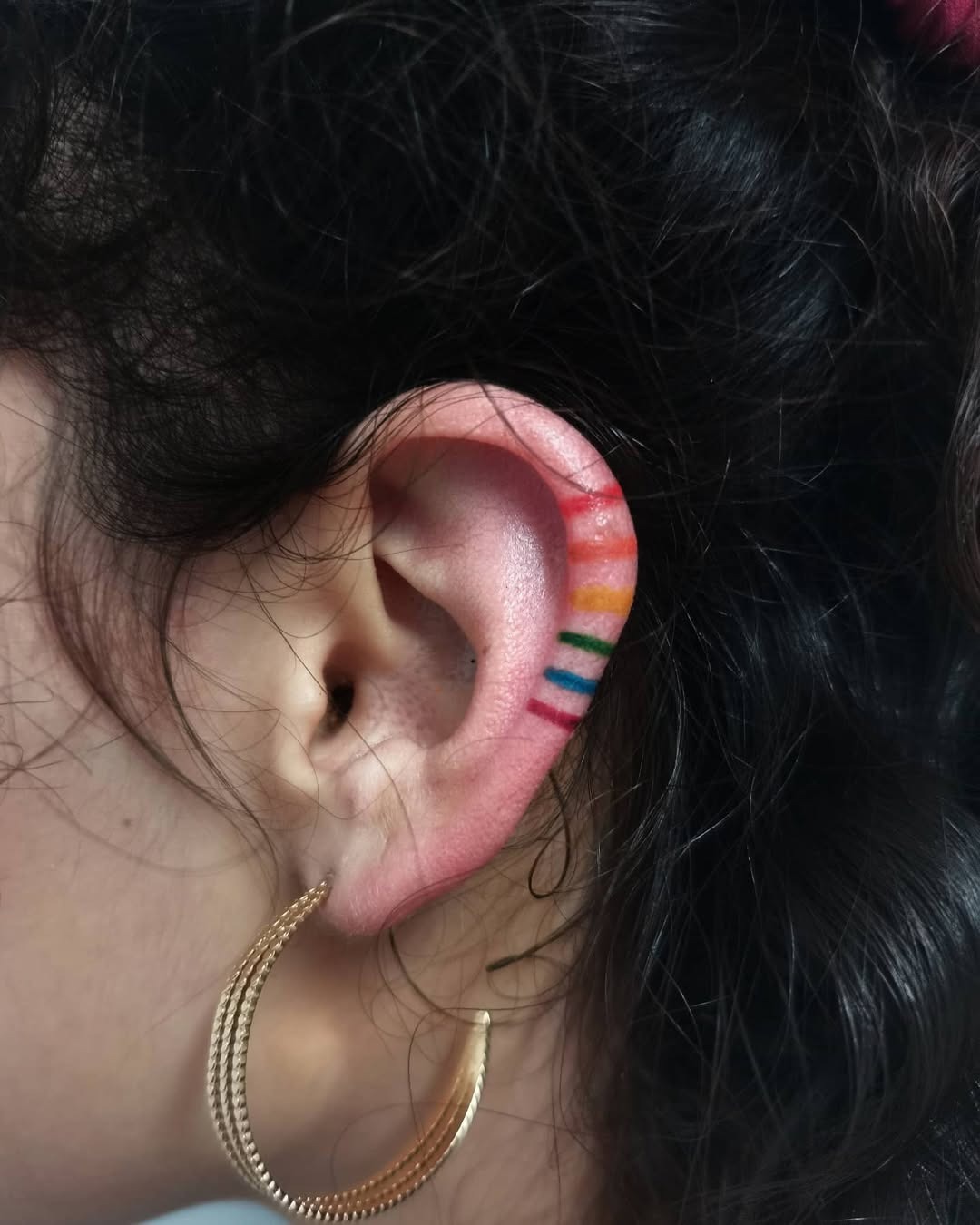 Vibrant Rainbow Tattoo on Ear Inspiration Tattoo Design