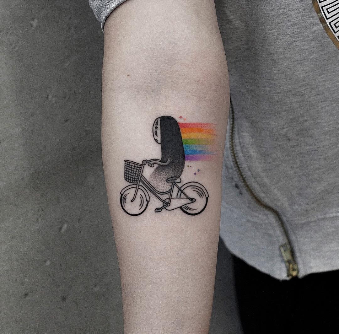 Whimsical Rainbow Tattoo of a Biking Figure Tattoo Design