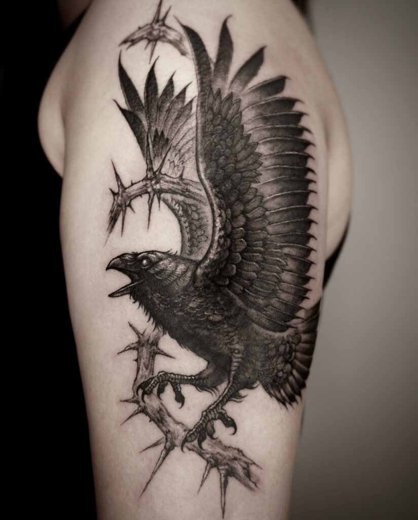 Fierce Raven and Thorned Branch Tattoo Design