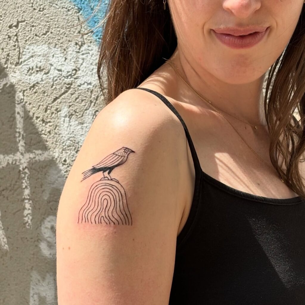 Minimalist Raven on Abstract Rock Tattoo Design