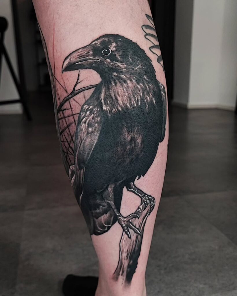 Realistic Raven Perched on a Branch Tattoo Design