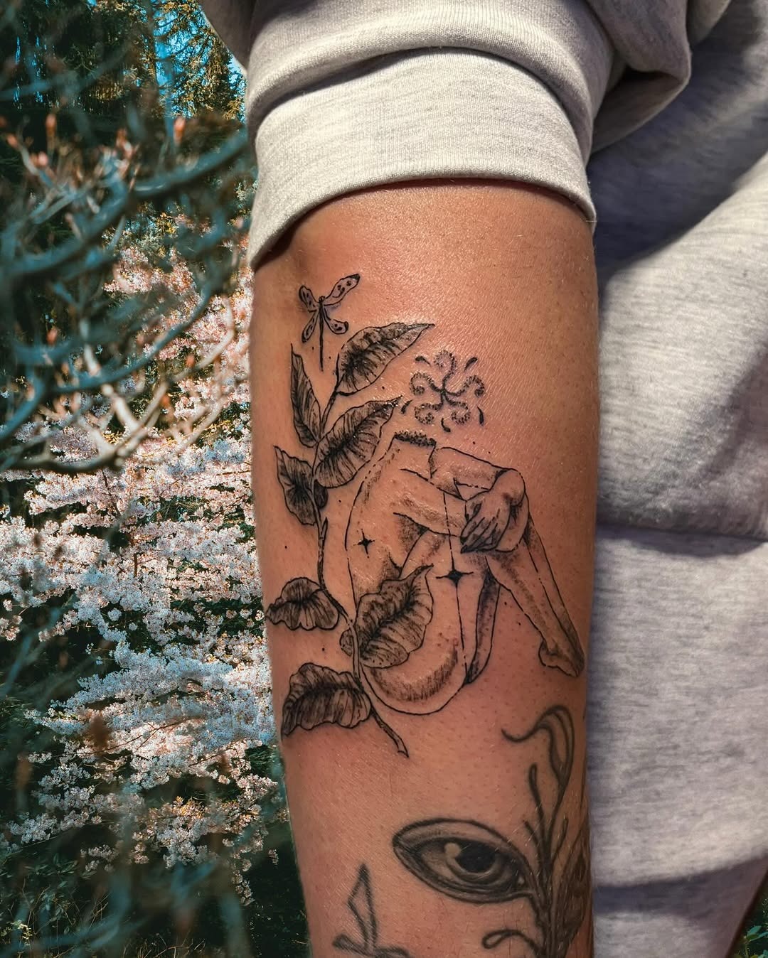 Elegant blend of nature and human form Tattoo Design
