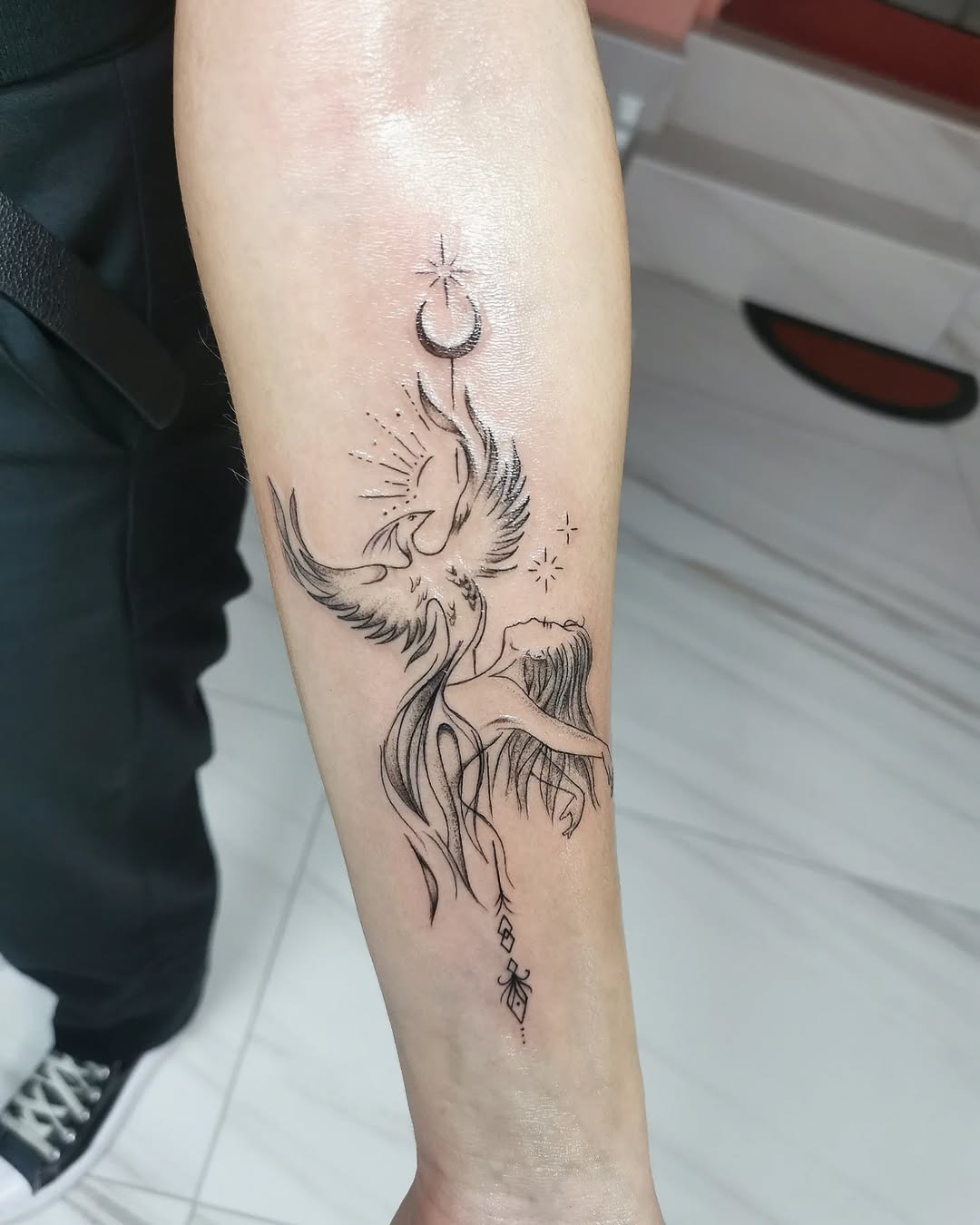 Elegant phoenix tattoo symbolizing rebirth and renewal Tattoo Design