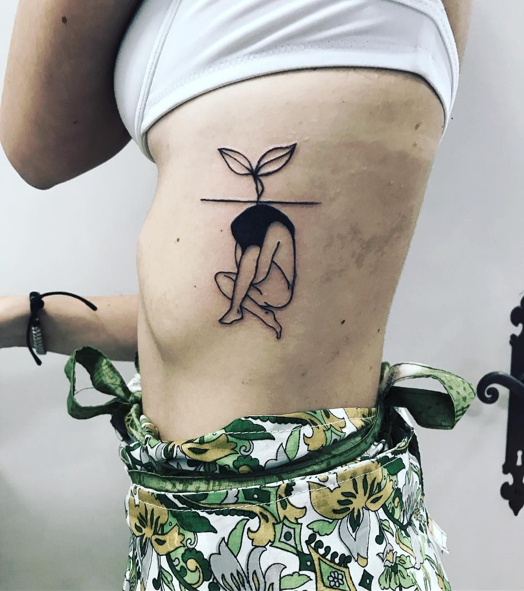 Minimalist tattoo symbolizing growth and rebirth Tattoo Design