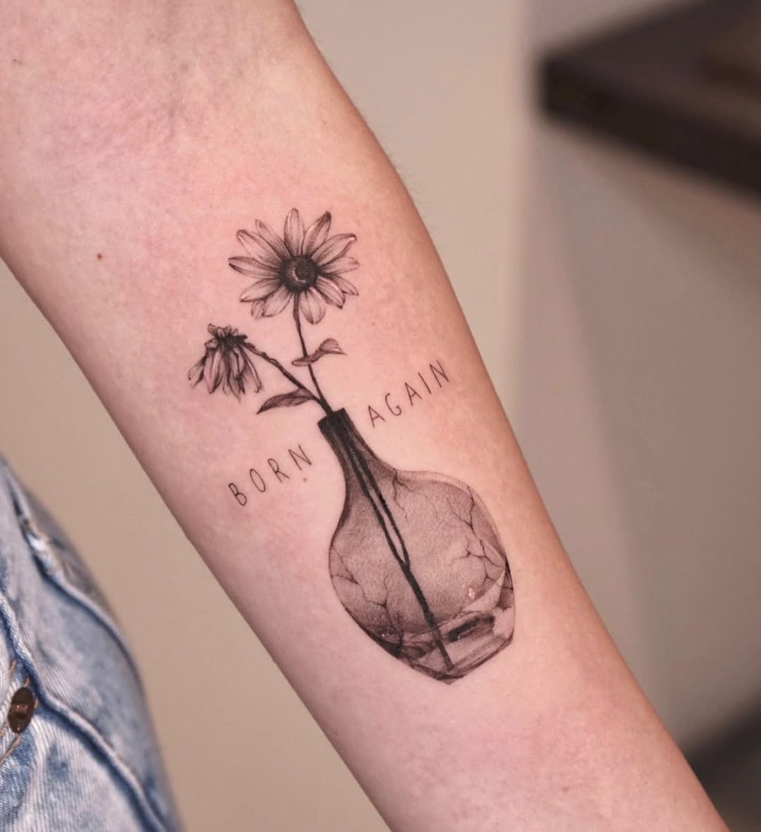 Symbolic rebirth through floral artistry. Tattoo Design