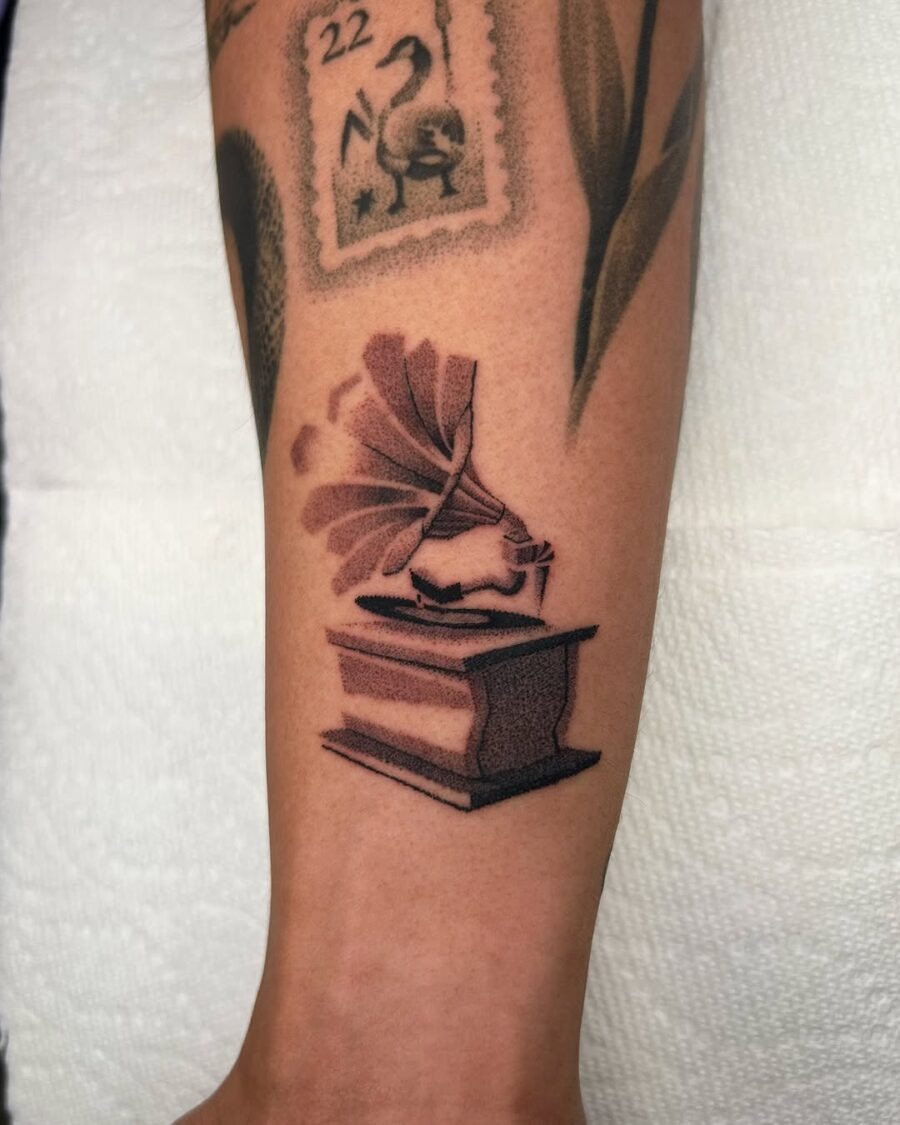 Classic tattoo featuring a vintage record player Tattoo Design