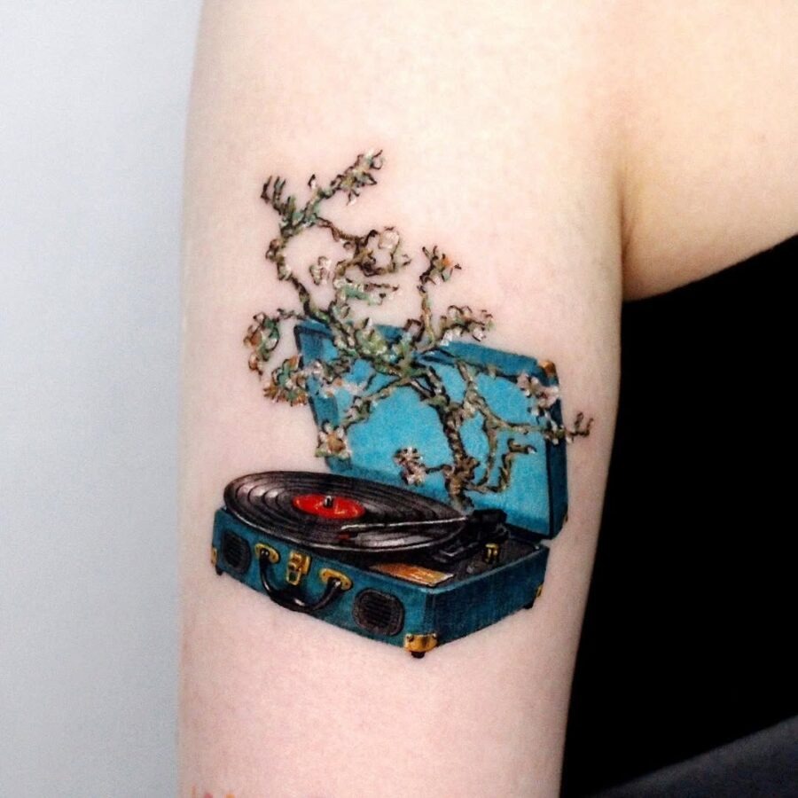 Elegant tattoo of a record player with blossoms Tattoo Design
