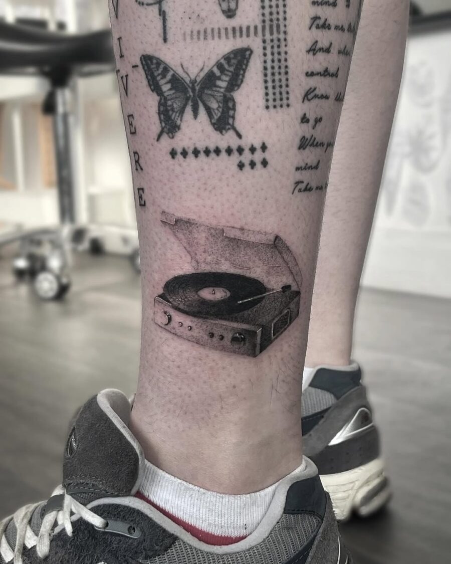 Stylish record player tattoo on leg Tattoo Design