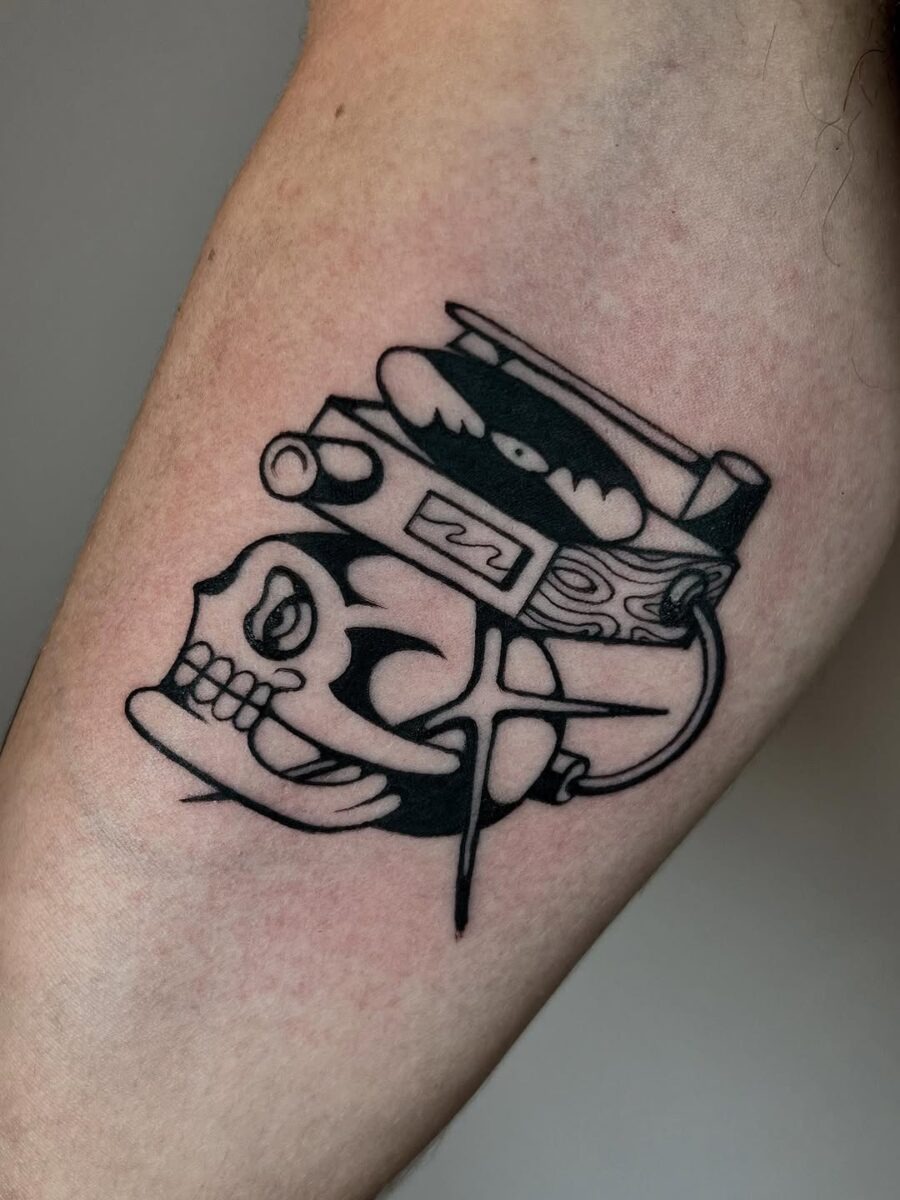 Stylish skull with record player tattoo design Tattoo Design