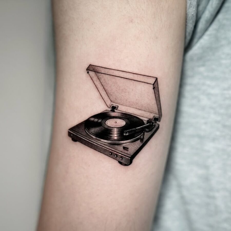 Vintage record player tattoo captures musical nostalgia Tattoo Design