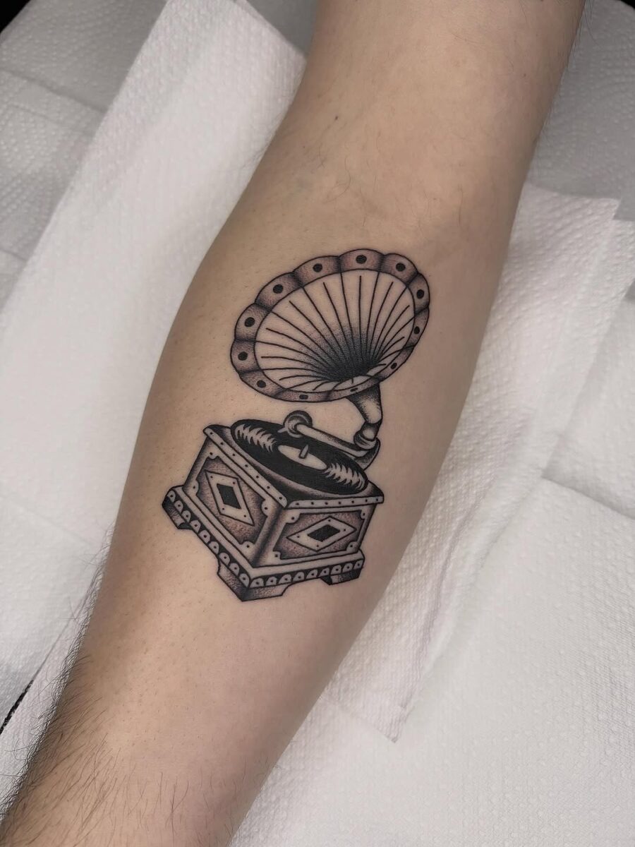 Vintage record player tattoo showcasing classic vibes Tattoo Design