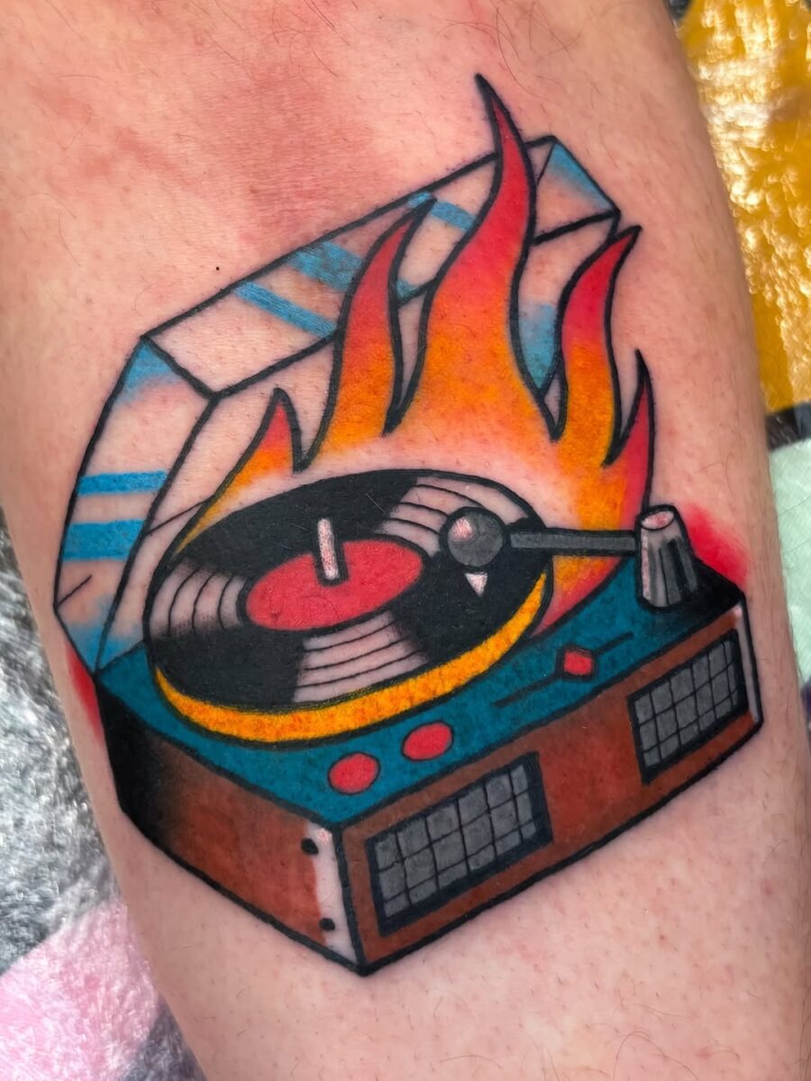 Vivid record player tattoo with fiery flair Tattoo Design