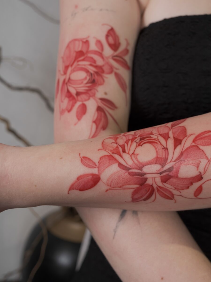 Bold Red Ink Flower Tattoo on Arm Tattoo Design