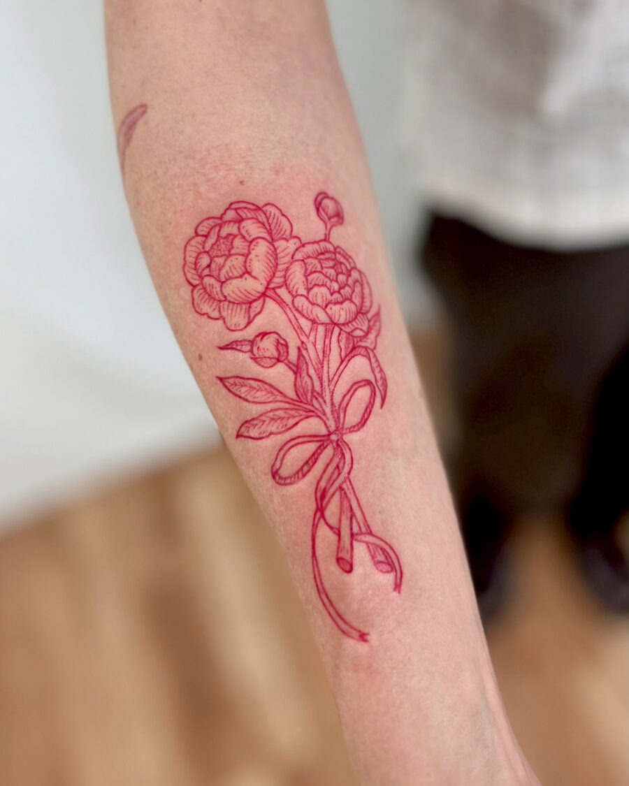 Bold red ink tattoo featuring a powerful quote Tattoo Design