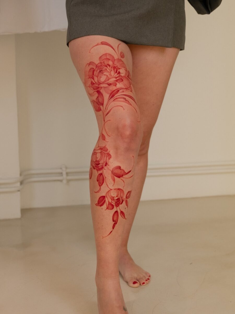 Bold red ink tattoos on intricately designed hands Tattoo Design