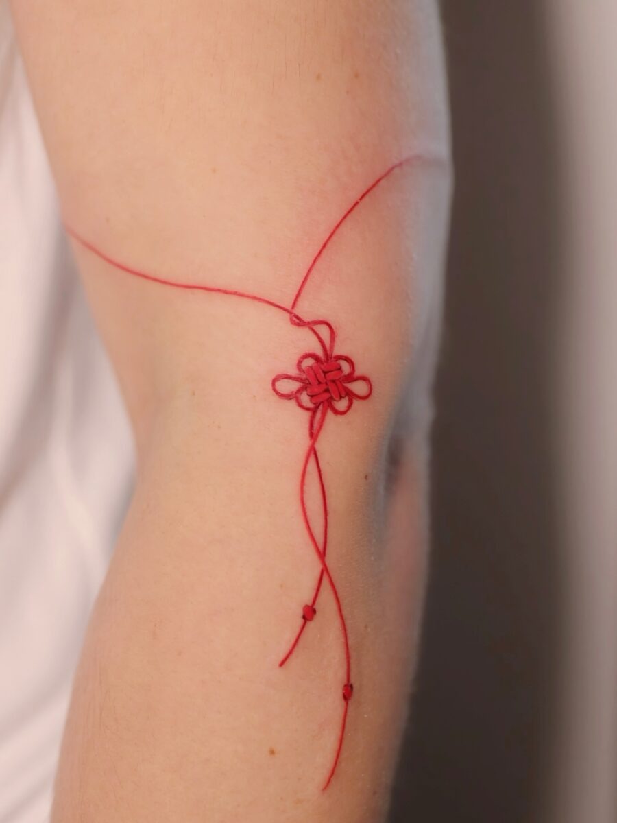 Delicate red ink flower tattoo Piece Tattoo Design